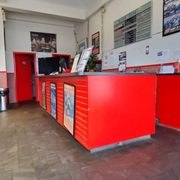 The service counter at Meriden Quick Lube, with tool storage behind it.